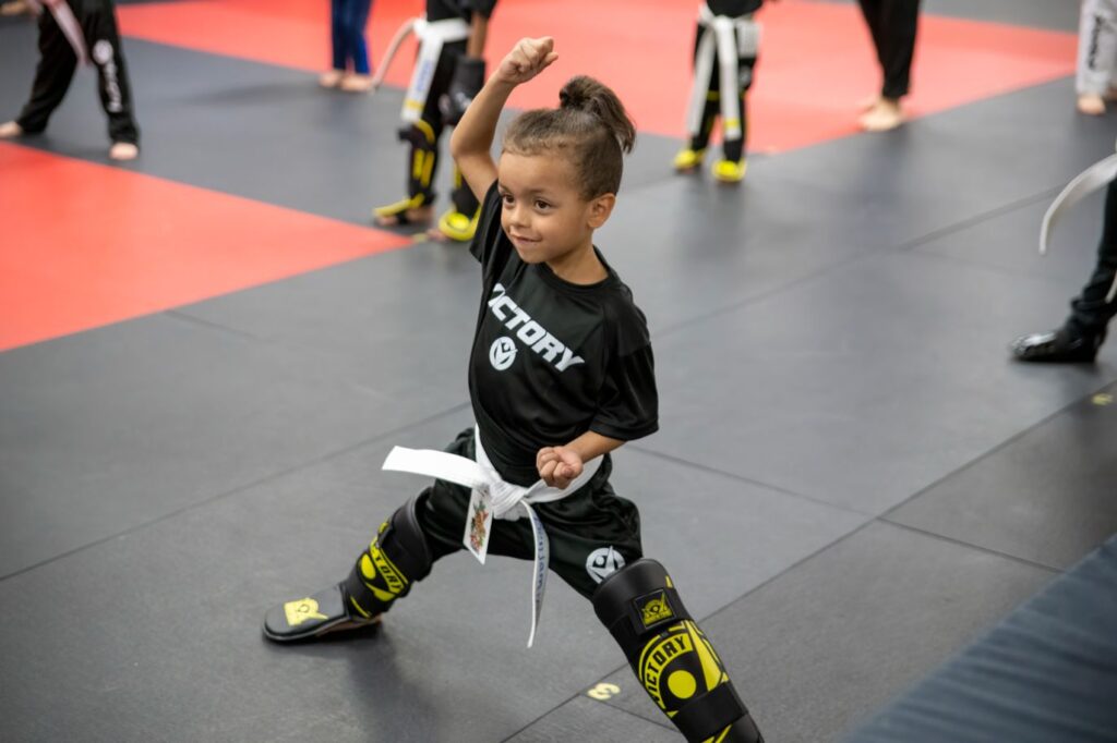Smiling Little Girl in a Karate Posture During a Training Session at Victory Martial Arts in Boca Park, Nevada