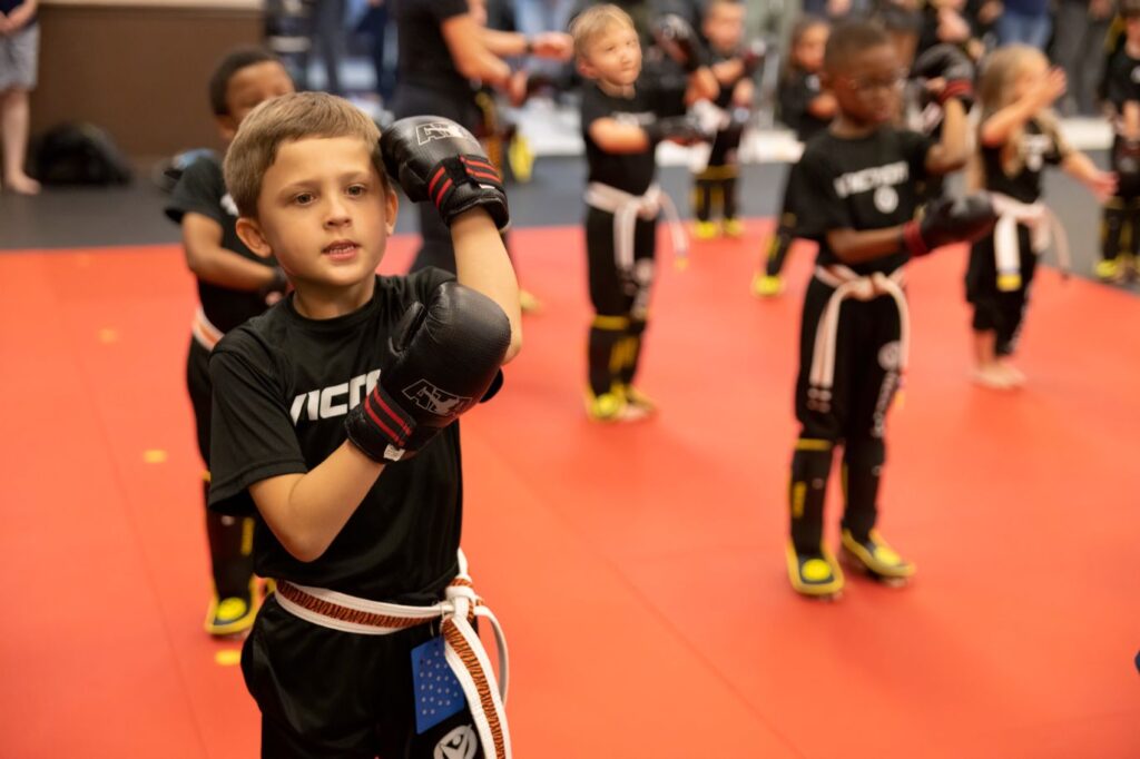 Boy With boxing Gloves During the Karate Workout With Other Kids at Victory Martial Arts in Arvada, Colorado