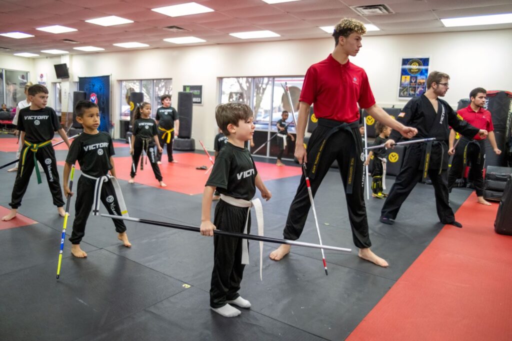 Instructors and Kids Practicing Martial Arts at Victory MA in Lake Nona