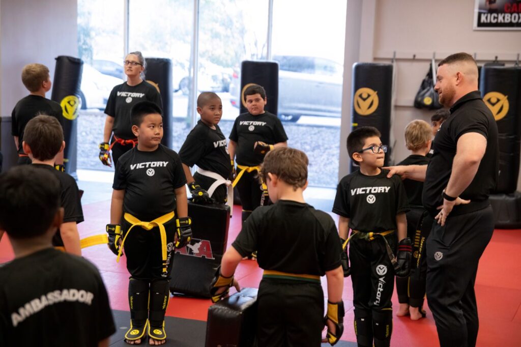 Karate Instructor Advising Kids During the Training Session at Victory Mazrtial Arts in Tenaya, Nevada