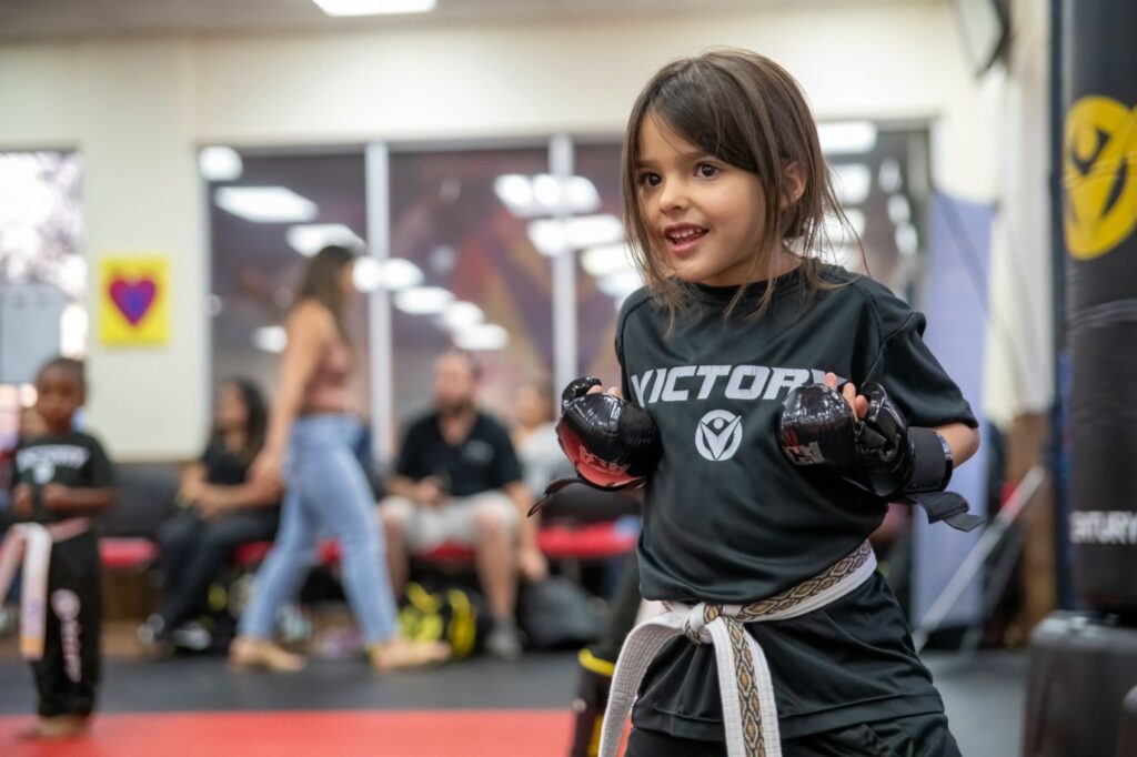 Smiling Little Girl in a Karate Posture During a Training Session at Victory Martial Arts in Grand Canyon, Nevada