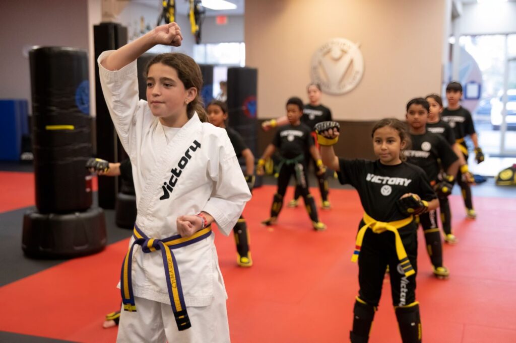 A confident Girl Leading the Kids Karate Training Session at Victory Martial Arts in Morgan Hill, California