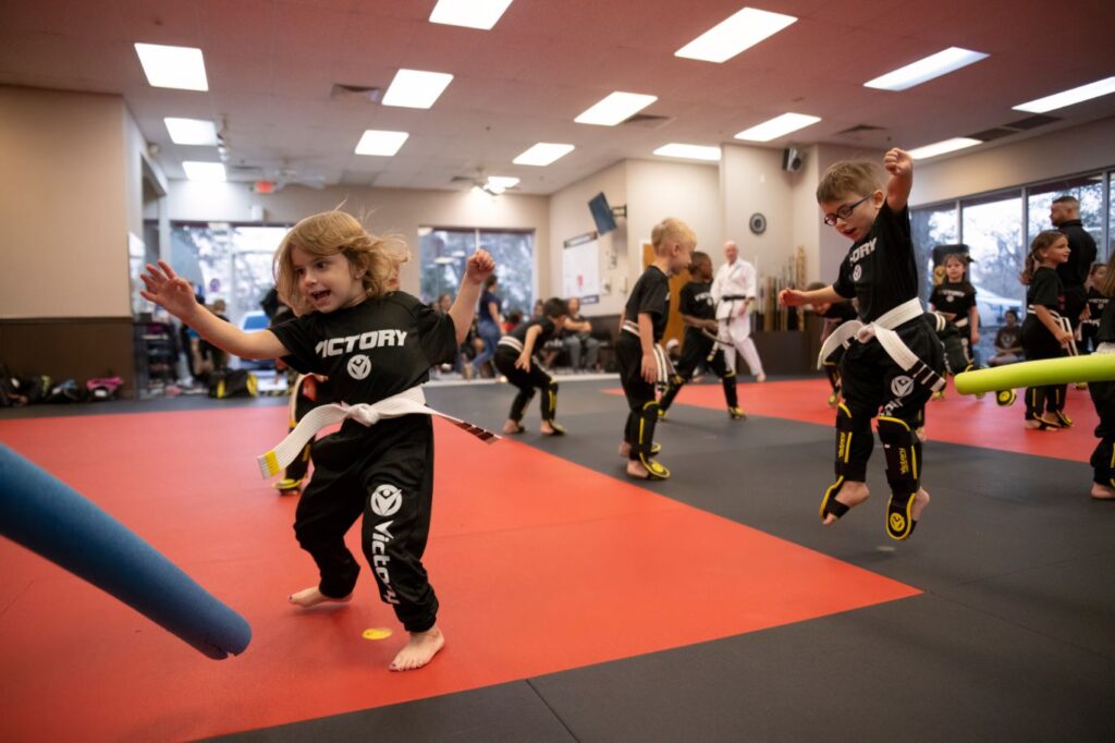 Group of Little Kids Jumping During the Children's Karate Training Session at Victory MA in Stone Ridge, TX
