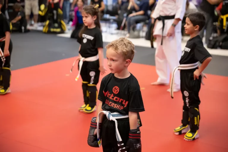 Two Boys And a Girl Standing on a Training Mat in Golden, Co.