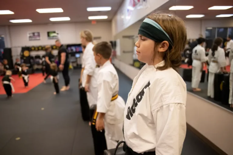 Boy in White Victory Martial Arts Kimono Standing During the Children's Karate Classs in Lee's Summit, Missouri